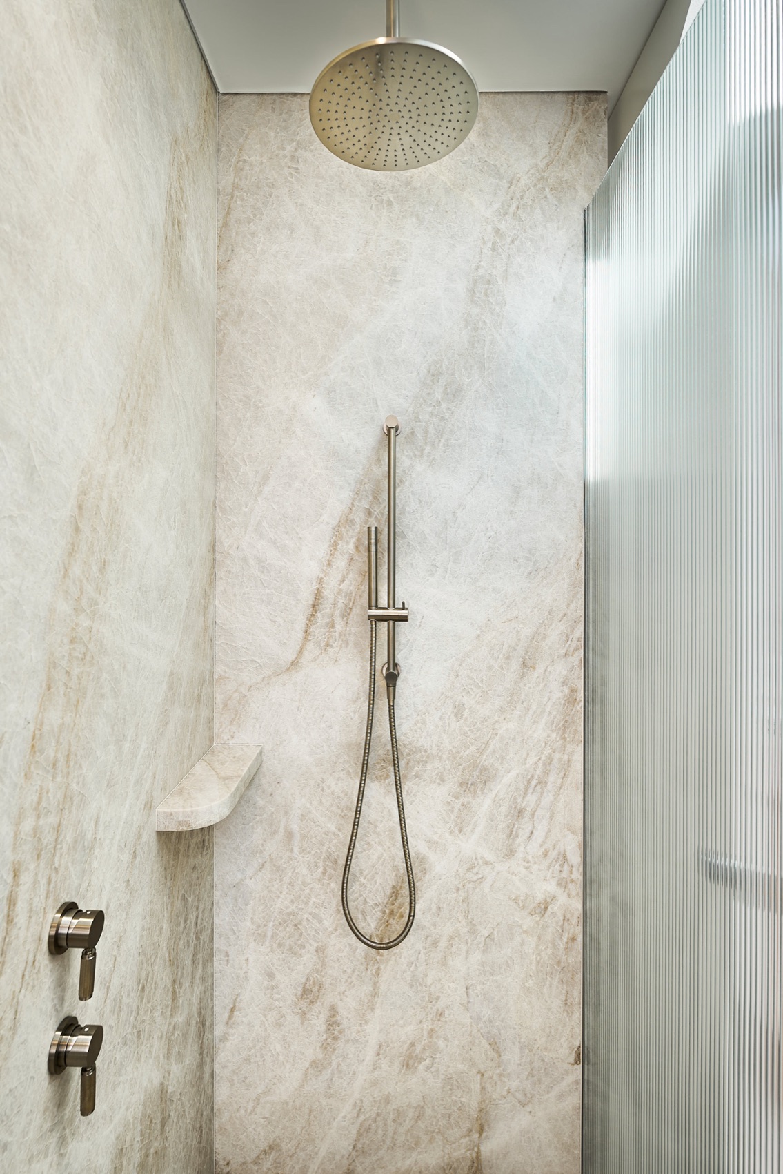 Natural stone shower by Perelli Group